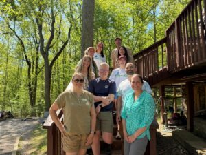board members on the steps of the Outdoor Lab